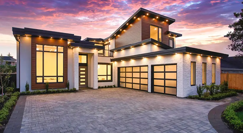 Professional garage door installation with modern doors on home in Dallas Texas