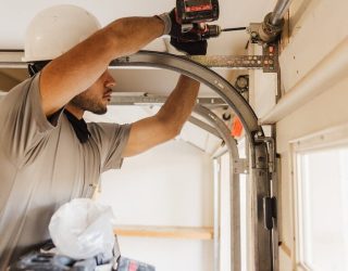 garage door installation Rockwall TX technician installing garage door track